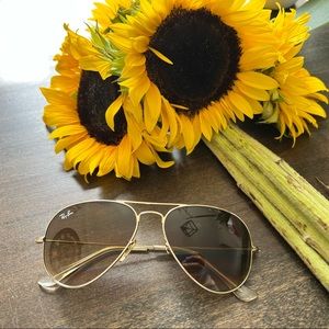 Used RayBan gold lined aviator sunglasses.